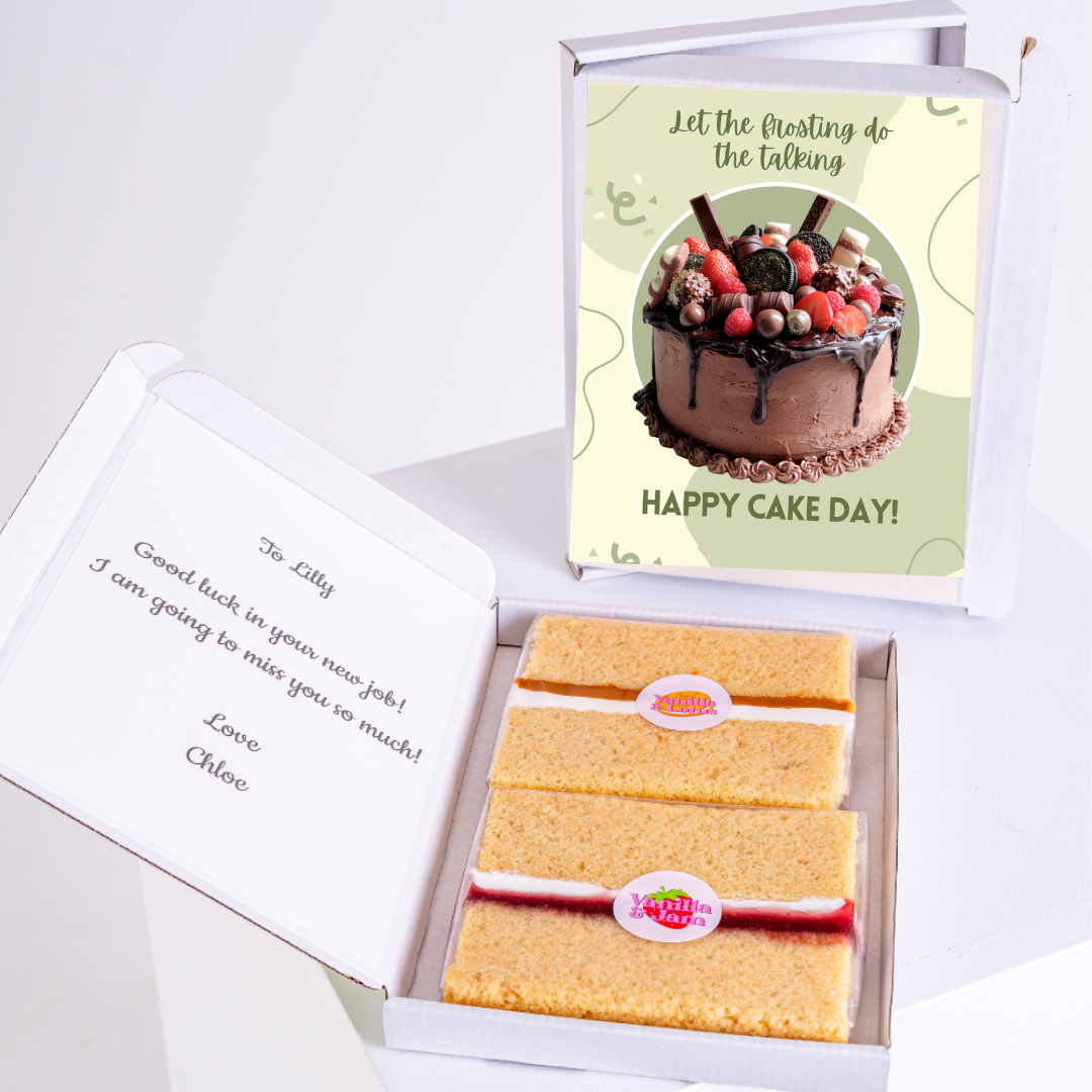 Cake box with Happy Cake Day! card and cake slices.