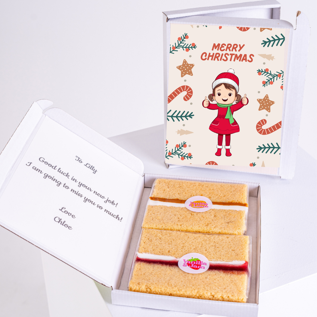 Christmas gift box with cake and Merry Christmas card