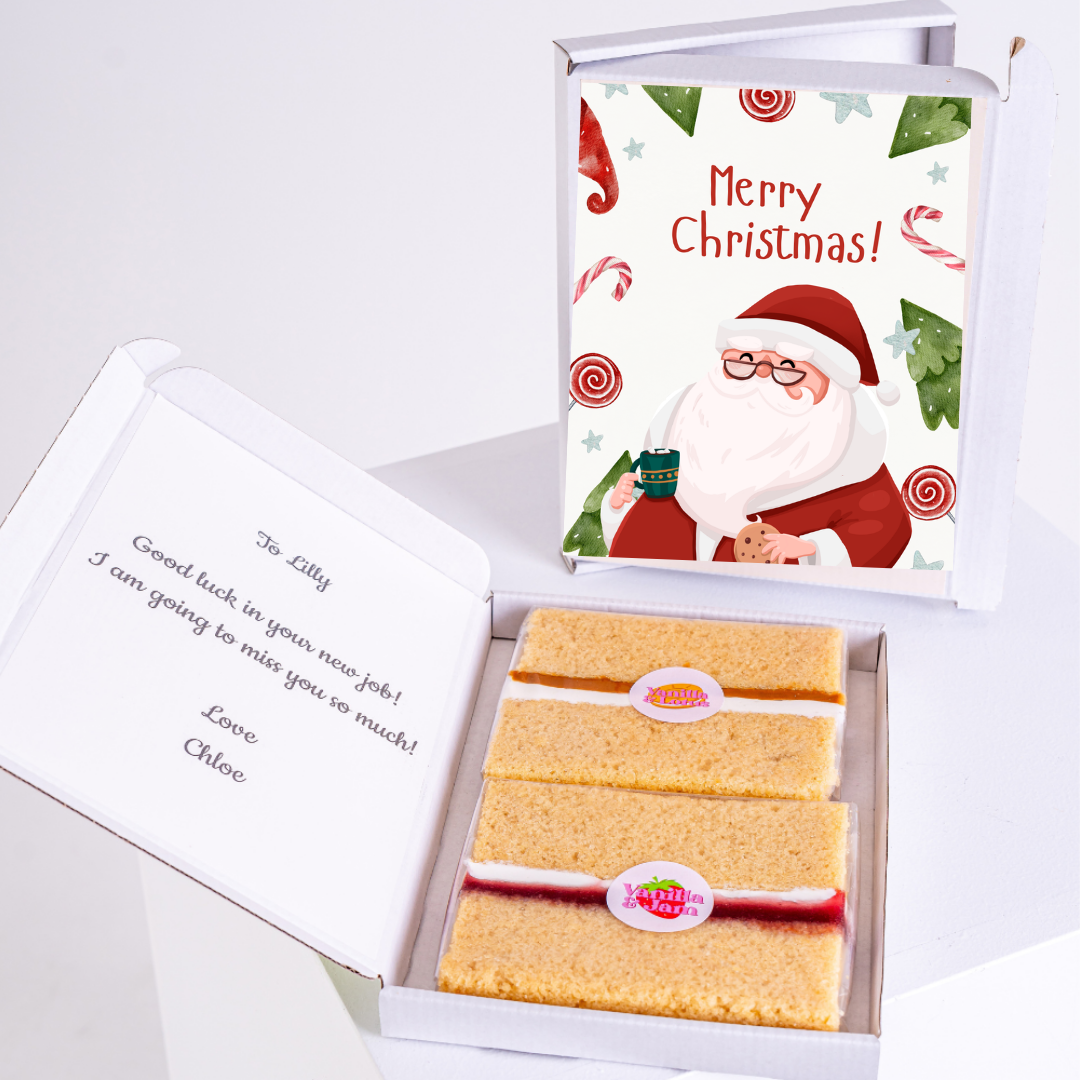 Christmas gift box with cake and Merry Christmas message.