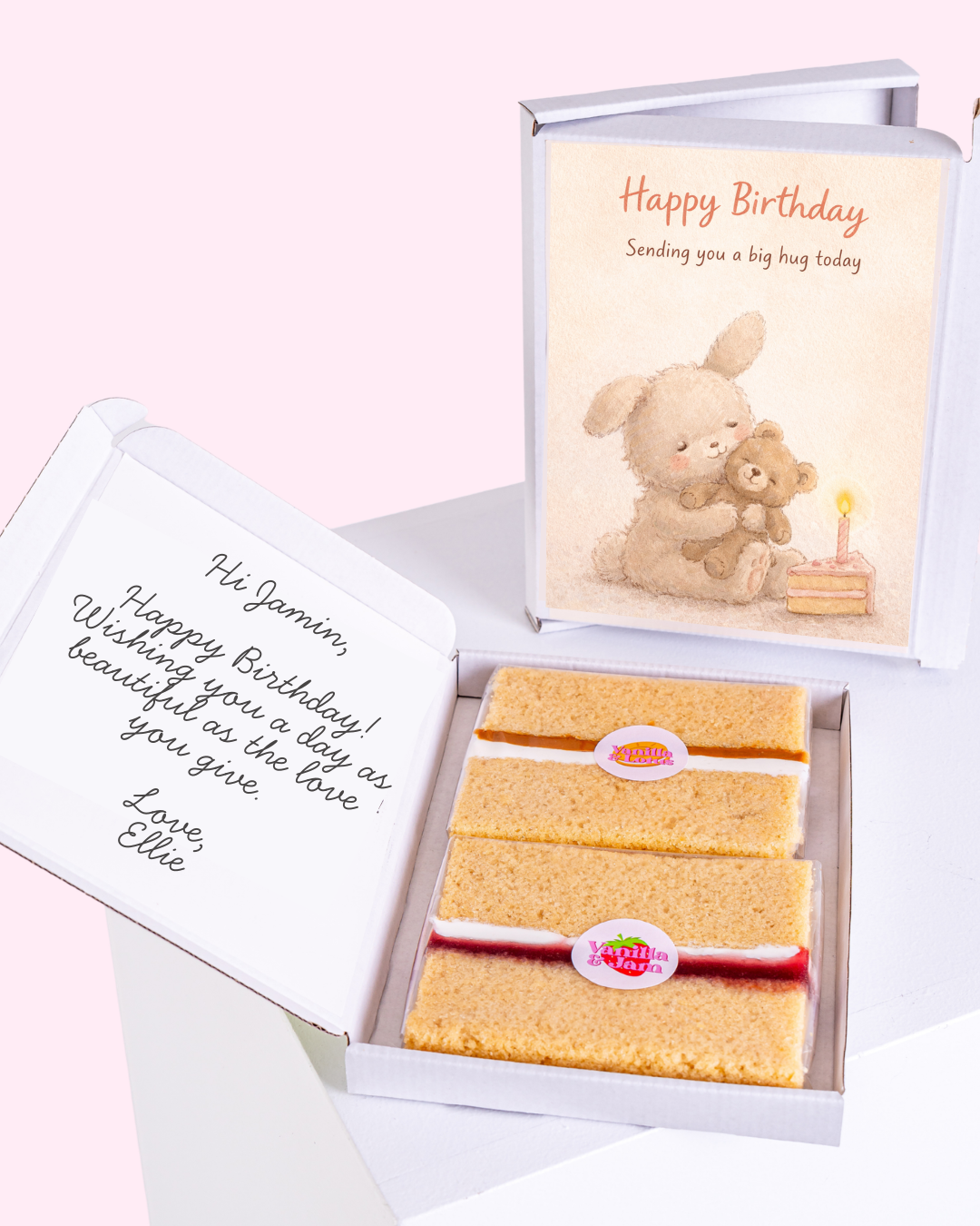 A cute birthday card featuring a bunny hugging a teddy bear, with a candle and a small cake