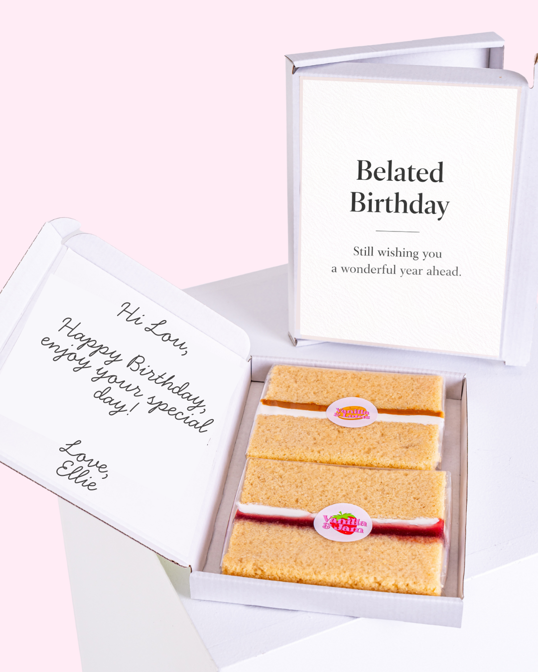 A belated birthday card featuring a gift box illustration, with a message wishing a wonderful year ahead. The card is paired with slices of cake inside the box.