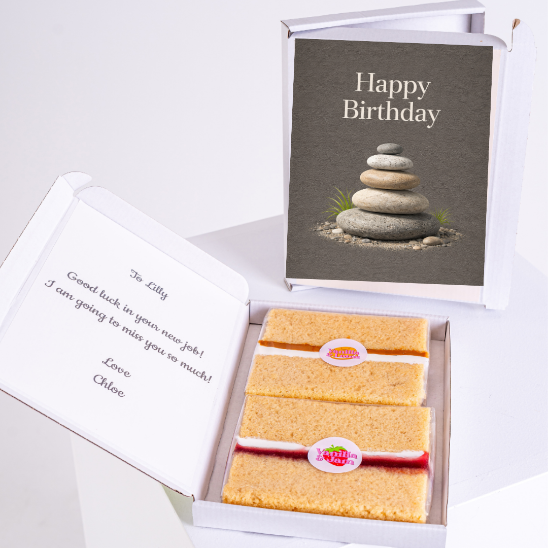A serene birthday card featuring a minimalist design with stacked stones symbolizing balance and calm, set against a gray background. The text "Happy Birthday" is displayed in a simple white font.