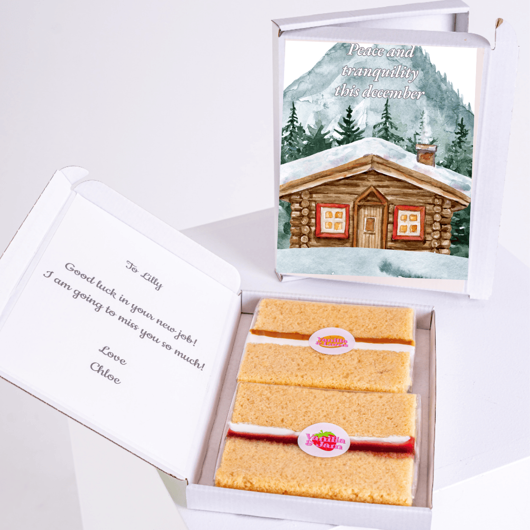 Cake gift box with Good luck message and mountain scene.