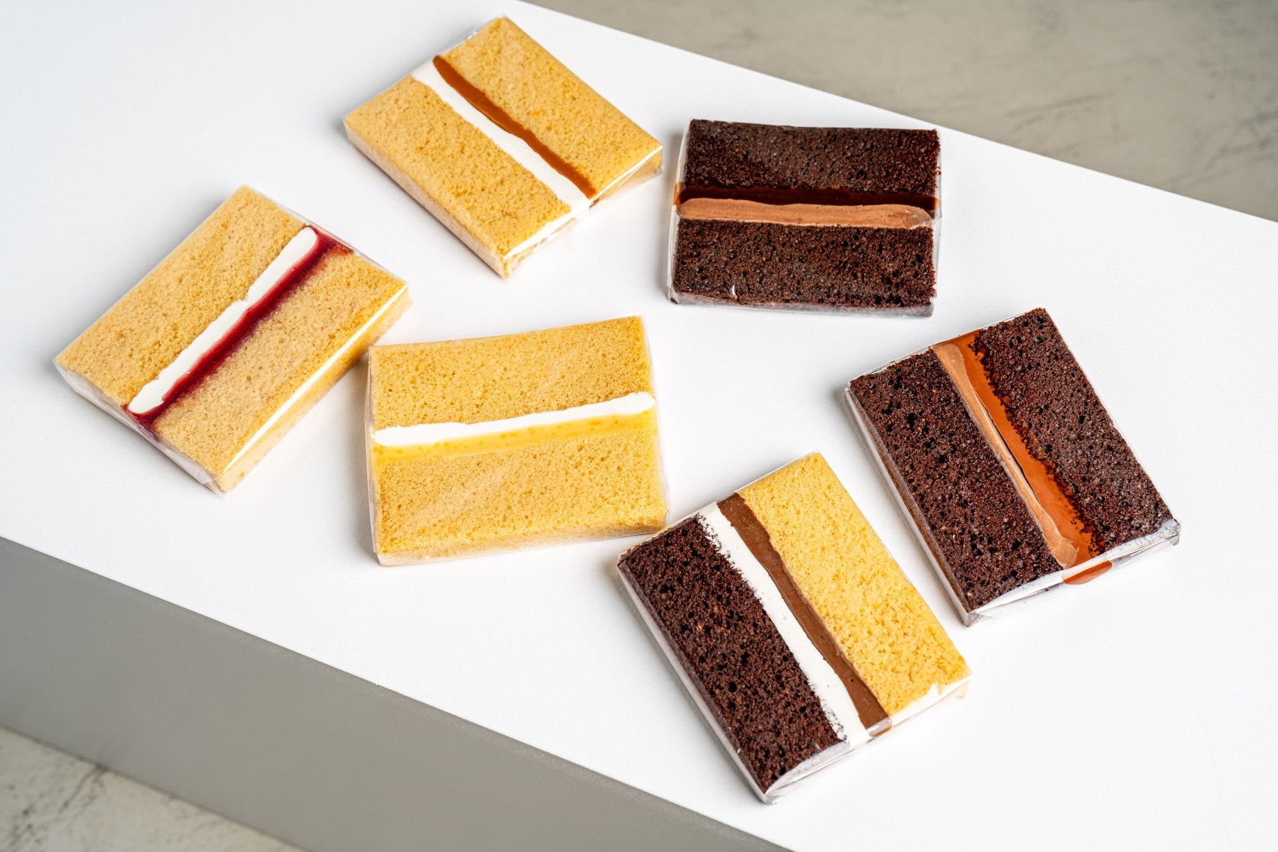 A selection of MailBakes vanilla and chocolate cake slices