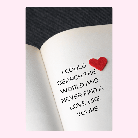 Love quote on book page with red heart