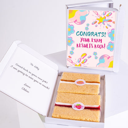 Vanilla gift box with exam results message and note.