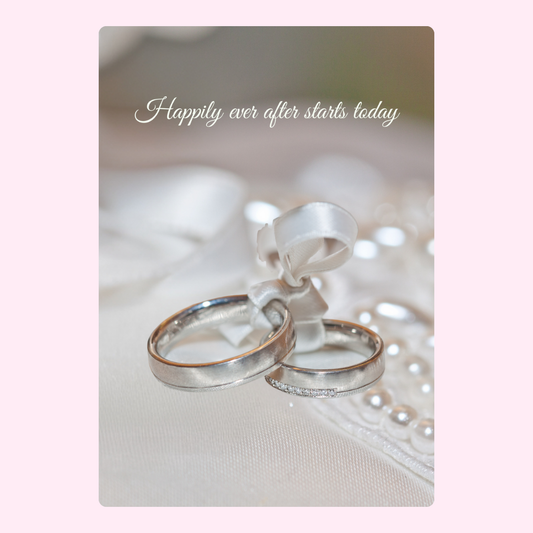 Wedding rings tied with ribbon, Happily ever after starts today