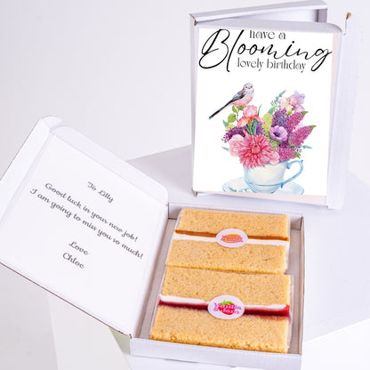 Birthday cake box with floral design and message.