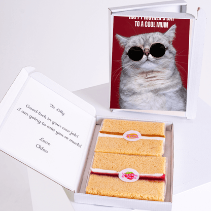 Gift box with cake and a Happy Mother's Day card with a cat in sunglasses.