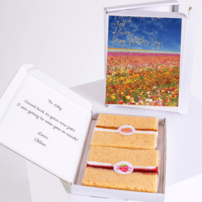 Mother's Day gift box with cake and field of flowers card.