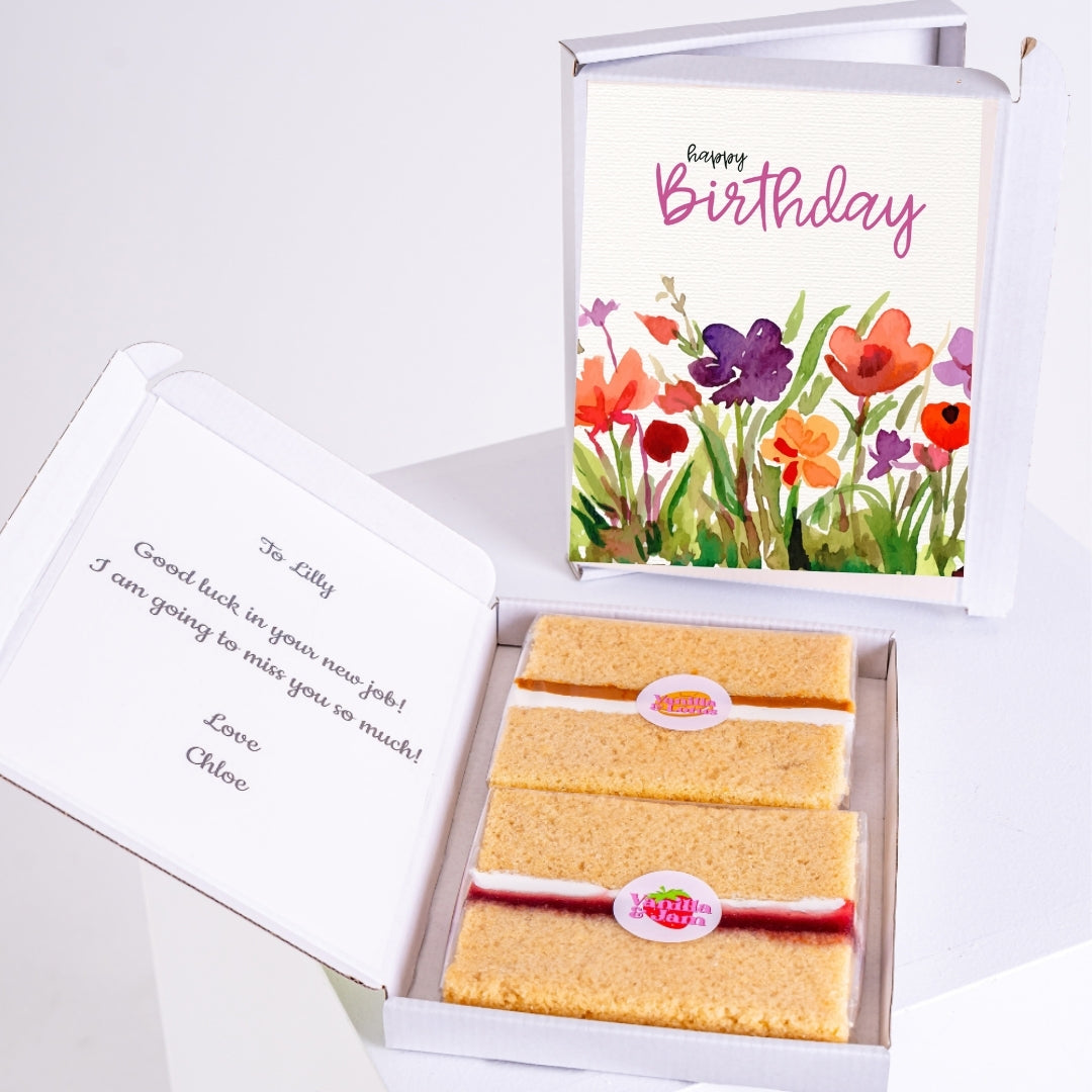 Letterbox cake gift with birthday message and floral design.