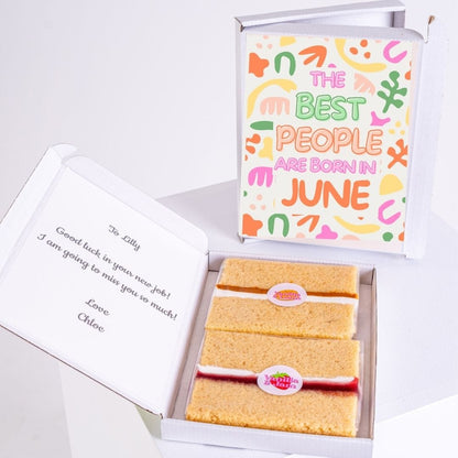 Cake slices in a box with text and a decorative box.