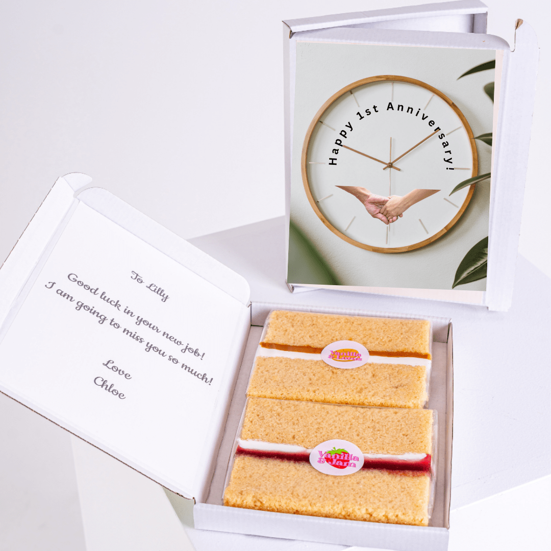 Cake box with Happy 1st Anniversary clock image and farewell message.