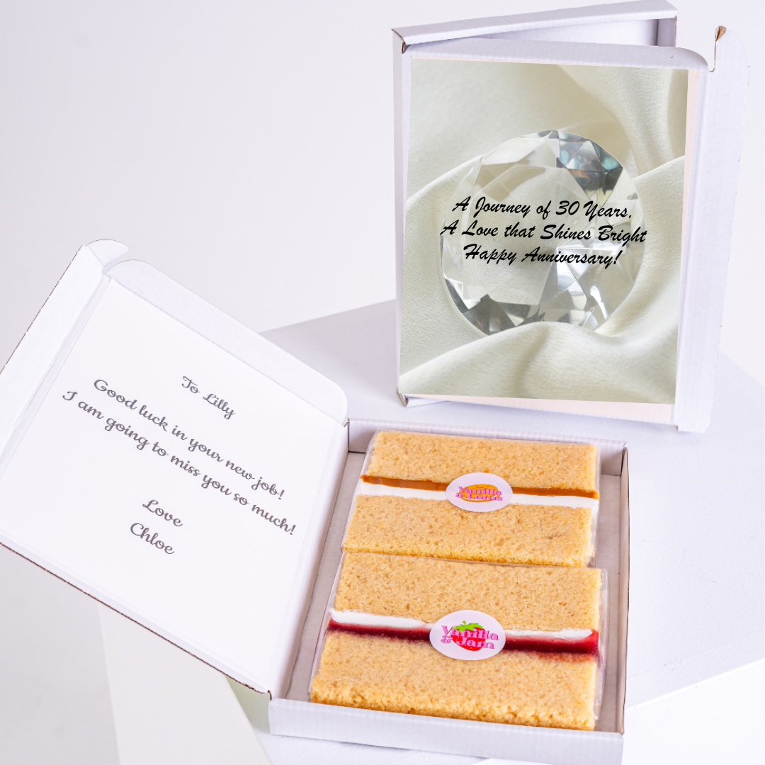 Gift boxes with cake, crystal, and anniversary/good luck message.