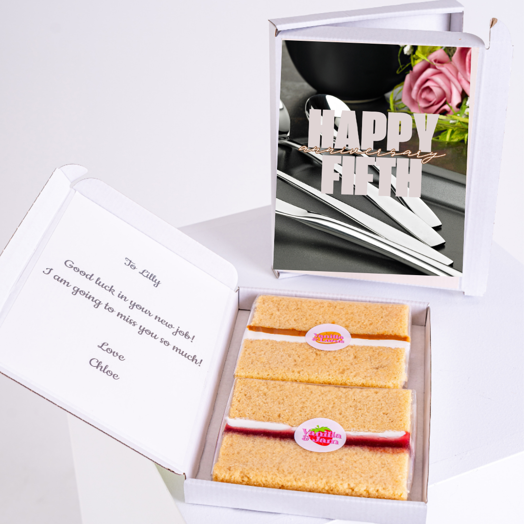 Cake box with Happy Fifth message, good luck note, and cake.