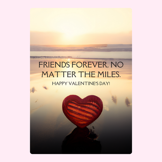 Heart on beach with friendship quote.