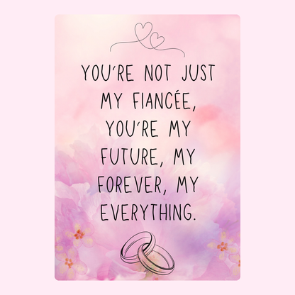 Engagement card with romantic quote and rings.
