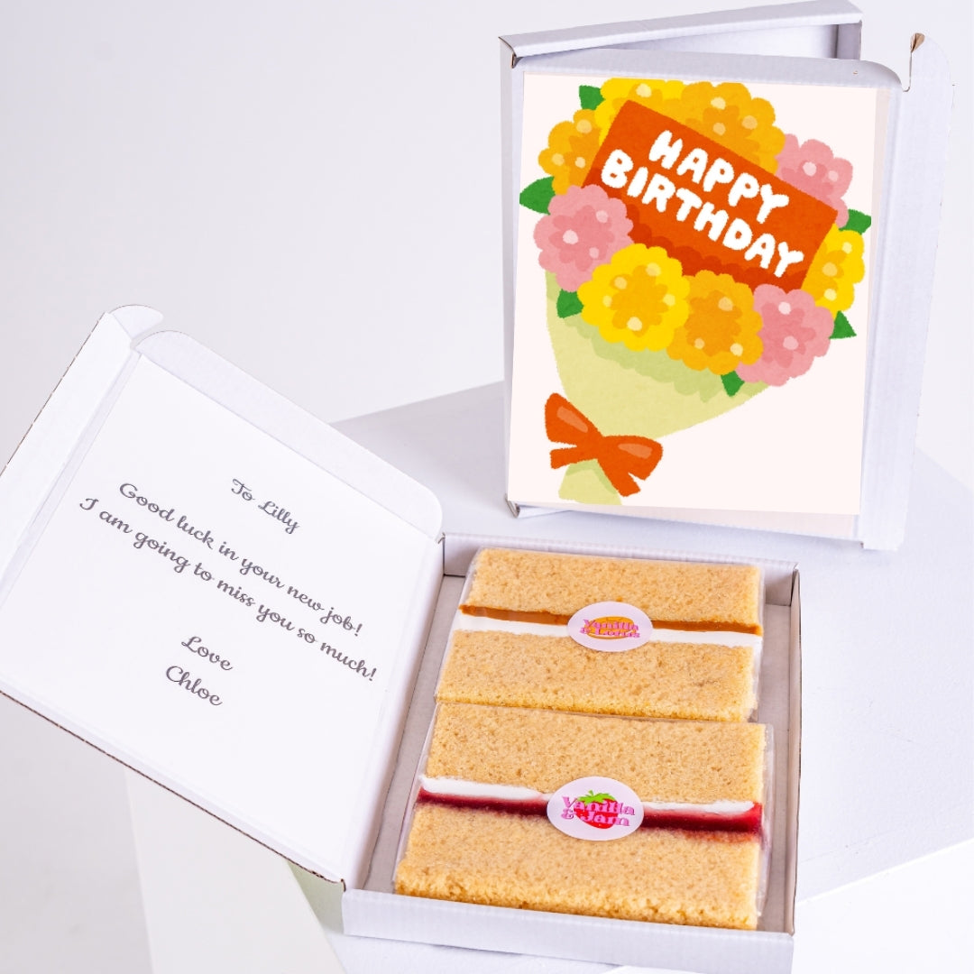 Letterbox birthday cake with floral design.