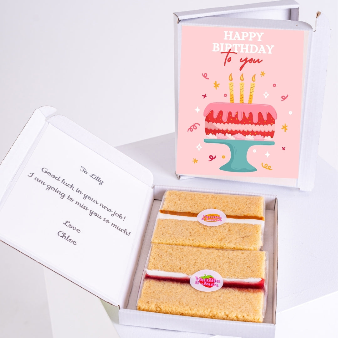 Letterbox birthday cake with layered slices and pink cake design