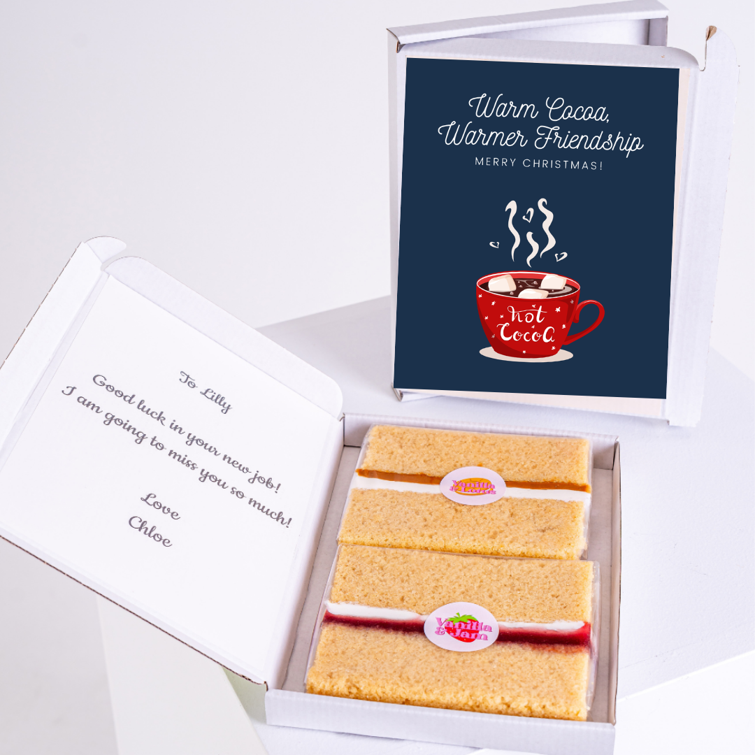 Christmas gift box with cake and Warm Cocoa message.
