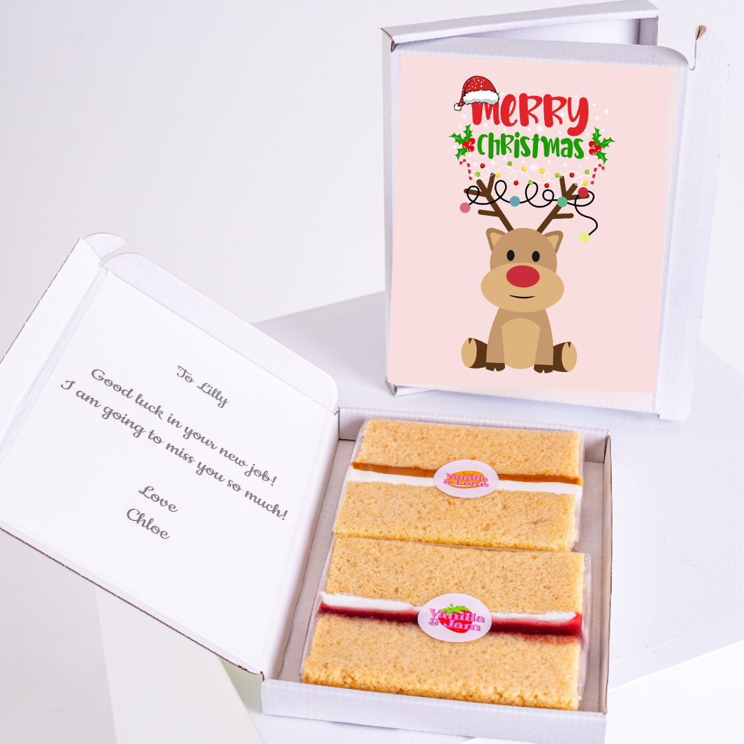 Christmas cake gift box with Merry Christmas card.