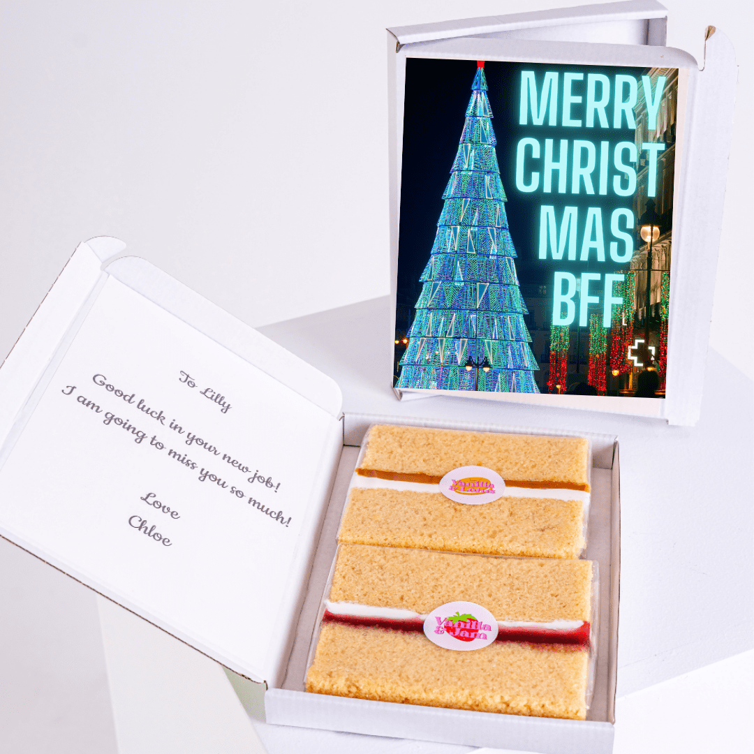 Cake in a box with a Christmas card.