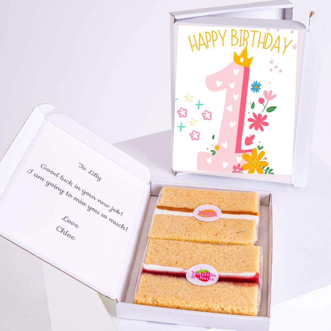 Birthday cake and card for Lilly's new job, featuring a number 1.