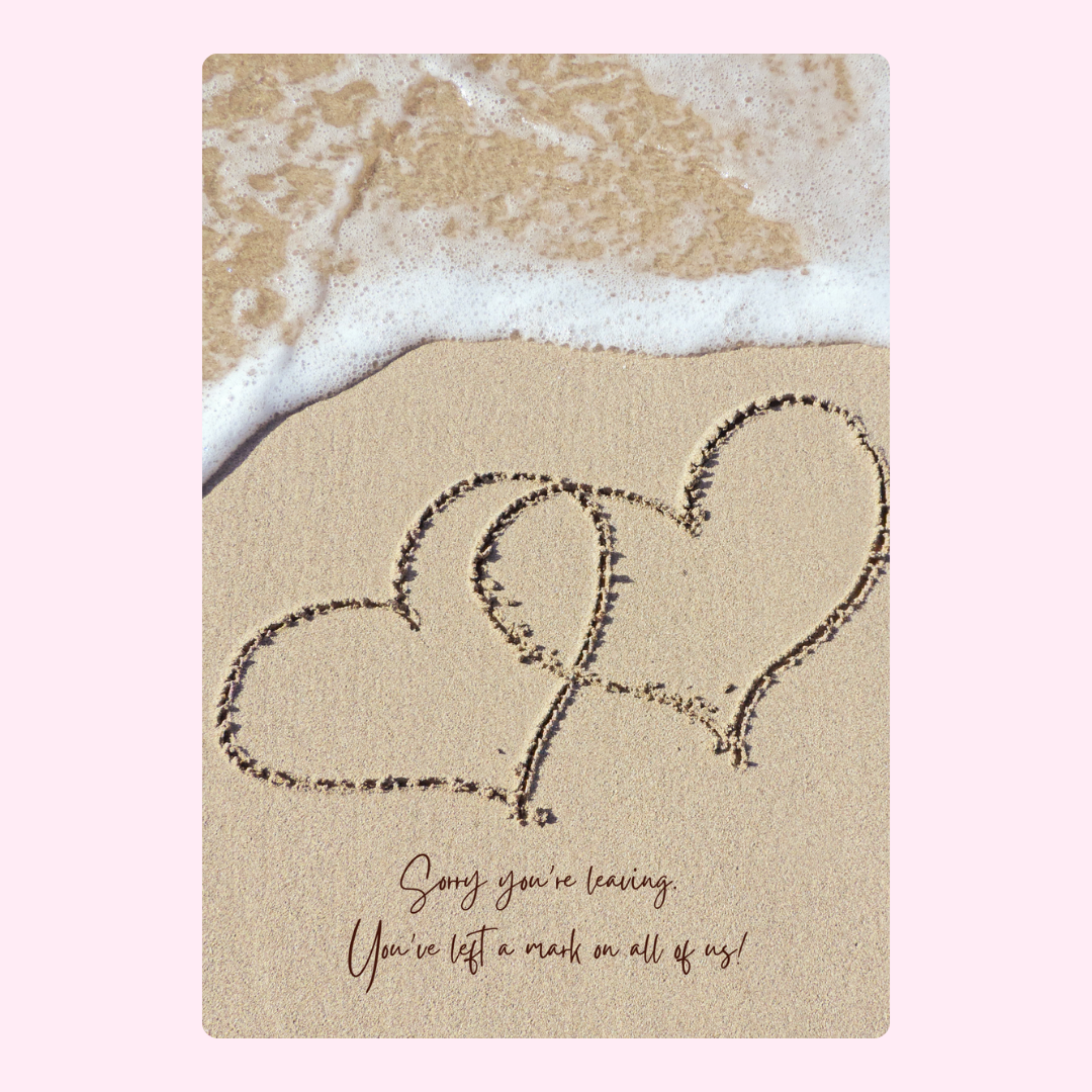 Hearts in sand with wave and message