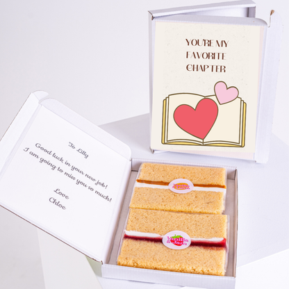 Farewell gift box with cake and a Favorite Chapter card.