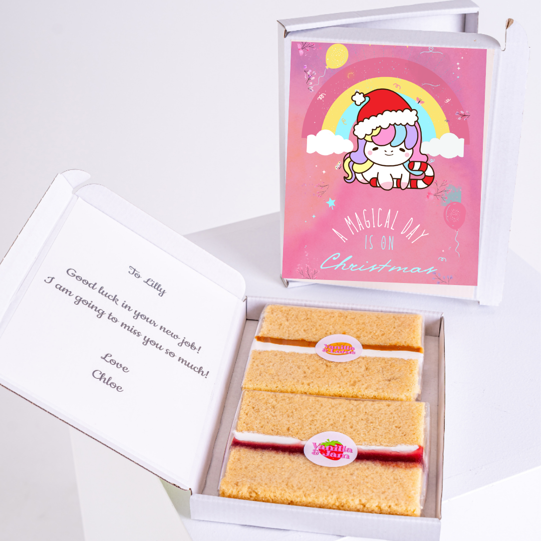 Christmas gift box with cake and unicorn card