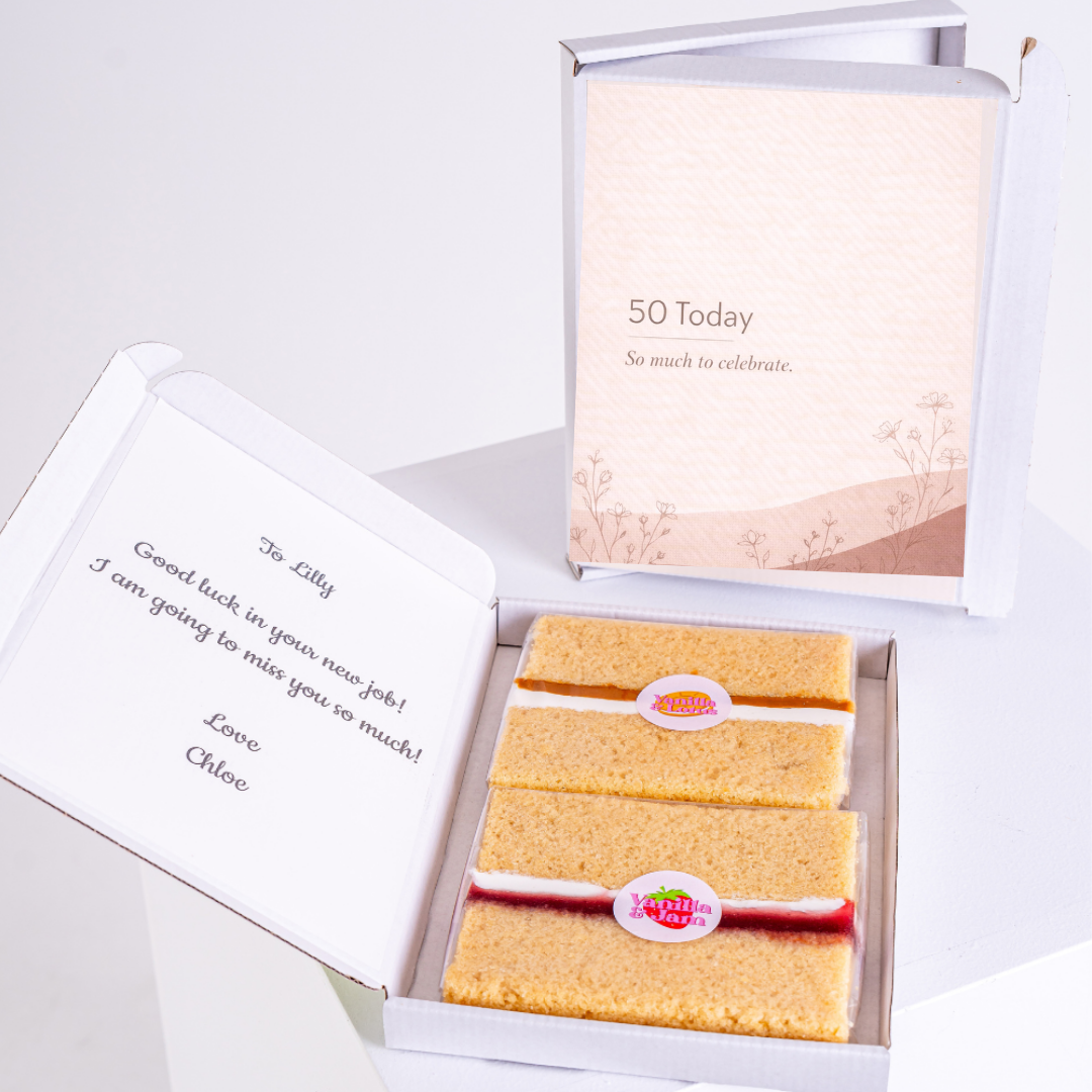 minimal 50th birthday cake card with sponge slices in box