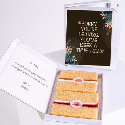 Leaving gift box with cake and card saying Sorry you're leaving