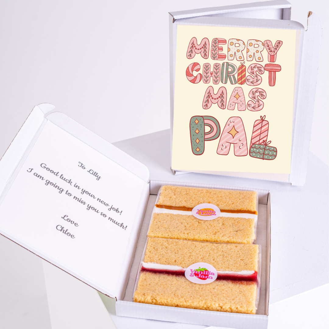 Cake slices in box next to a card that says Merry Christmas Pal.