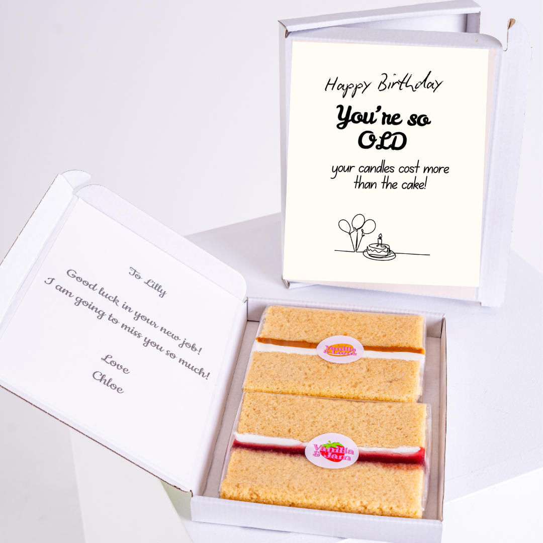 Birthday cake with a funny card in a gift box.