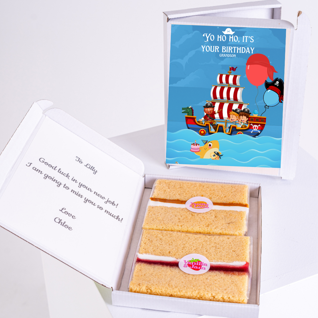 Birthday cake and card with pirate theme, gift box.