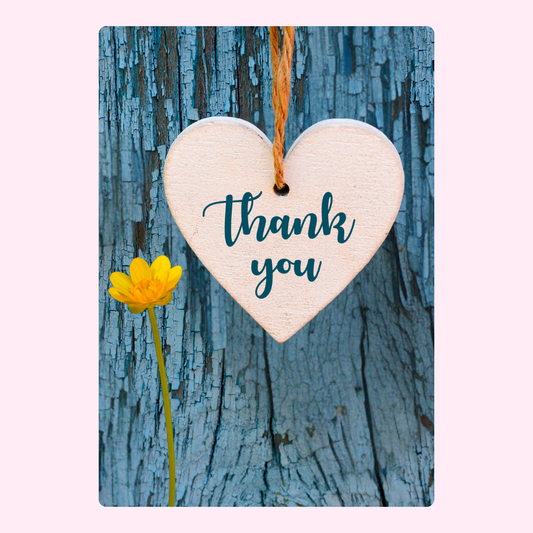 Thank you heart with flower and weathered blue background