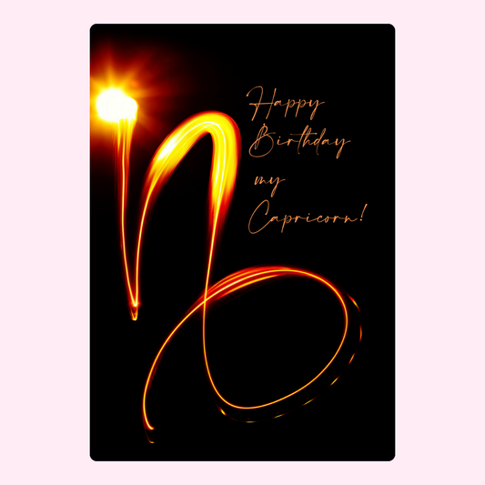 Happy Birthday Capricorn card with glowing Capricorn sign.