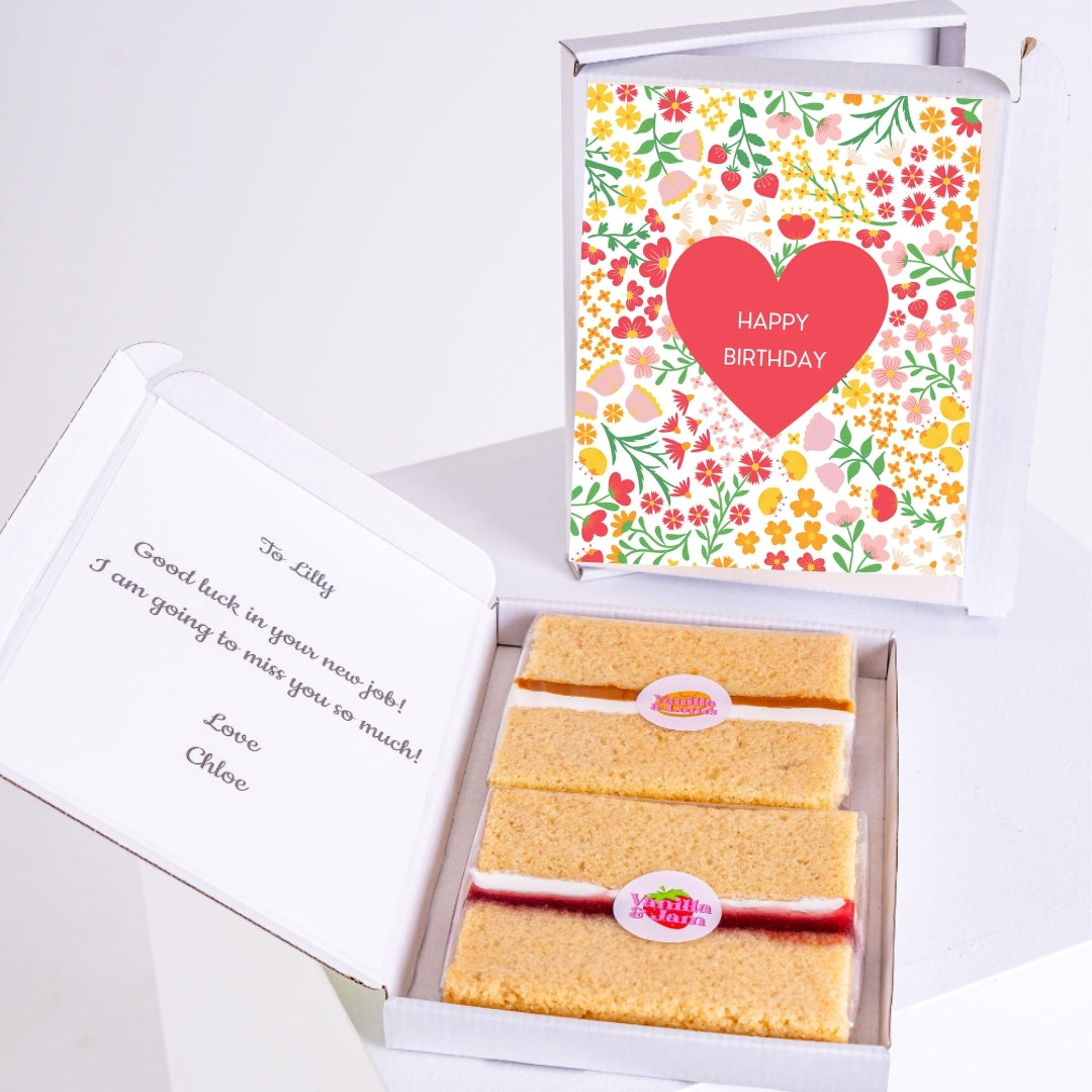 Letterbox birthday cake gift with heart and flower-themed birthday message.