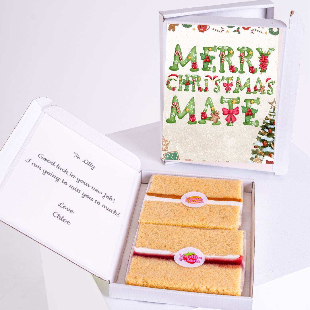 Cake slices in a box with a Christmas card.