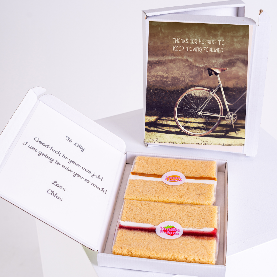 Farewell gift box for Lilly with cake and bike image.