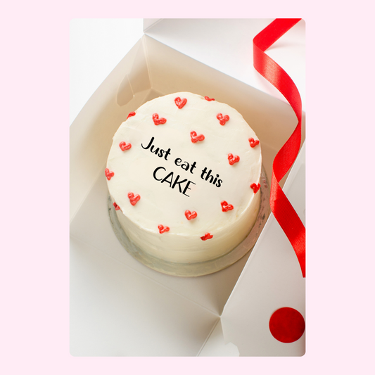Cake in box with Just eat this cake and red hearts