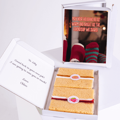 Cake slices in a gift box with a photo and message.