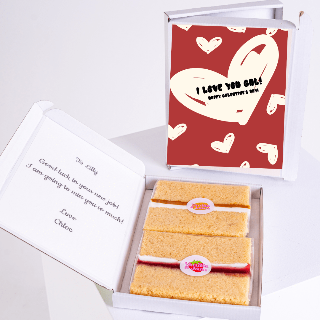 Cake slices and a card in open gift boxes.
