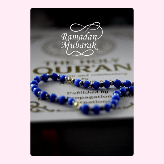 Ramadan Mubarak image with The Holy Quran and beads