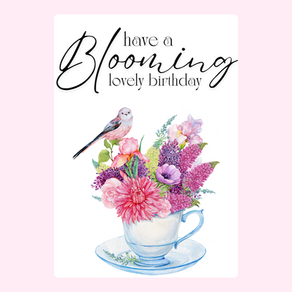 Floral teacup birthday design with a bird.