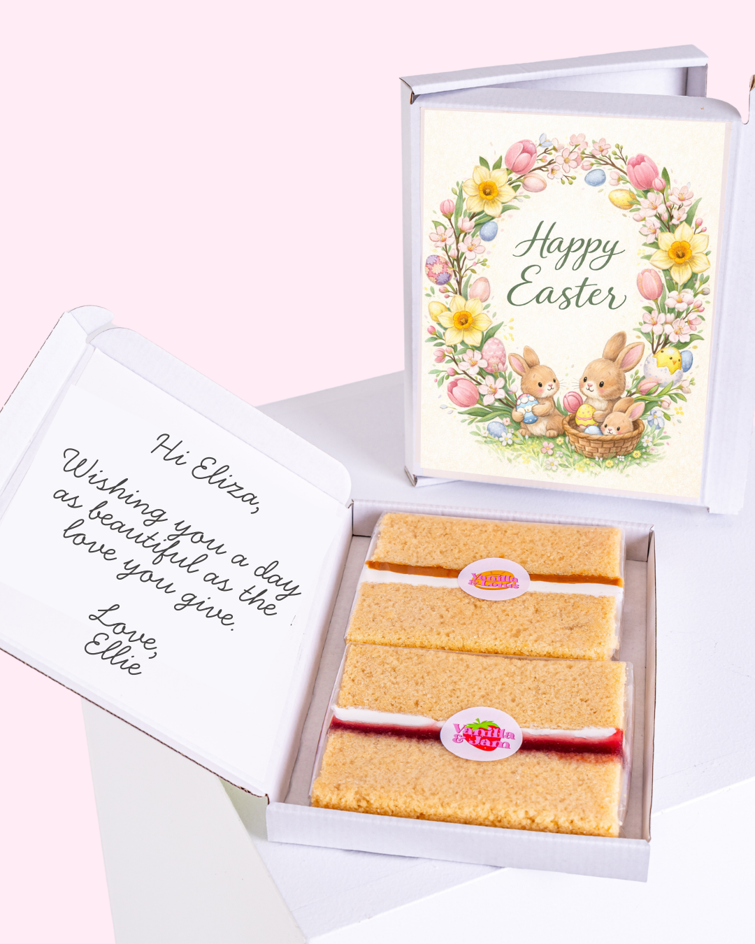 Happy Easter wreath with flowers and Easter eggs inside a gift box with cake slices.