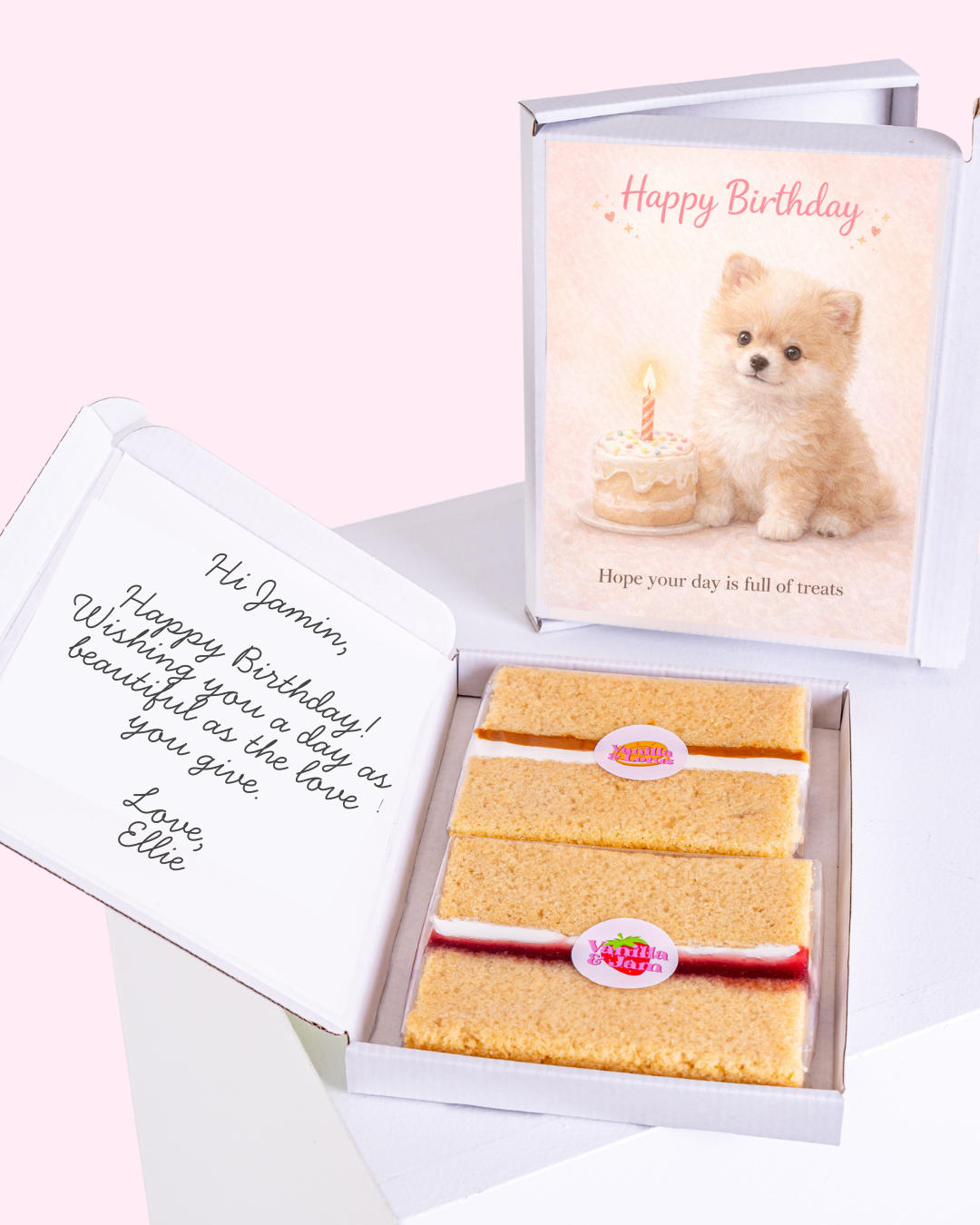 Cute puppy with birthday cake on "Happy Birthday" card, accompanied by vanilla biscuits inside