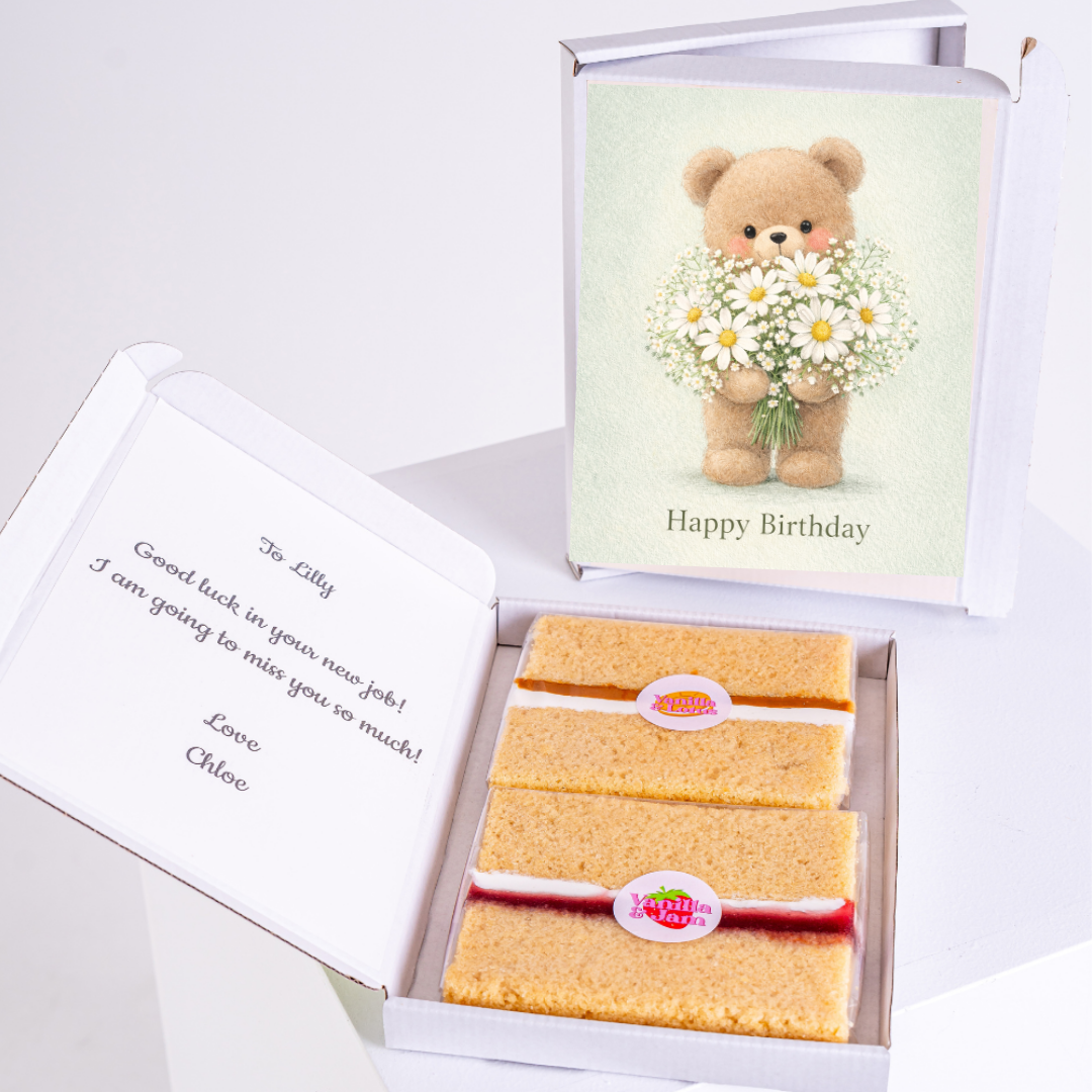 Teddy bear holding flowers on "Happy Birthday" card, with vanilla biscuits inside