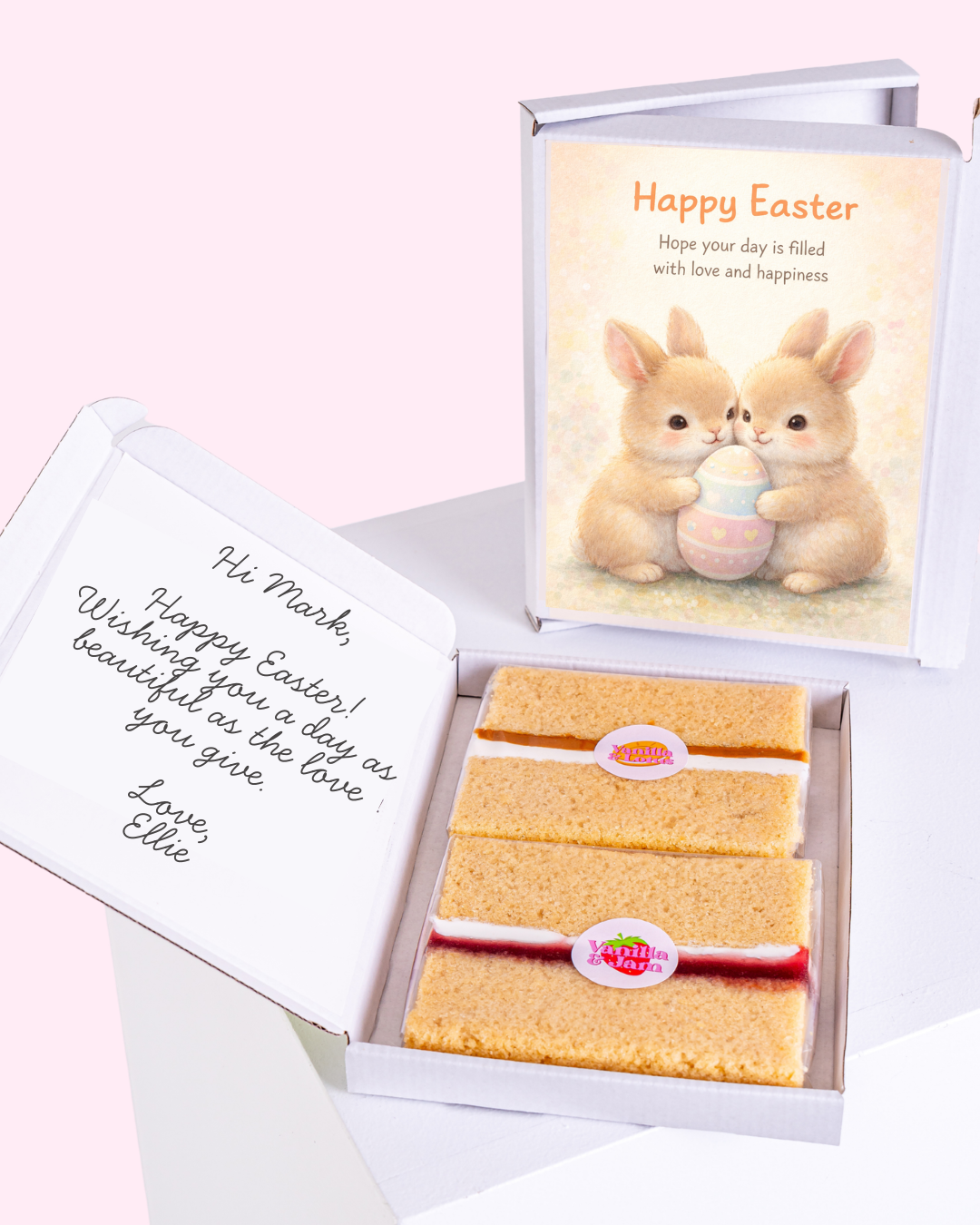 Two bunnies holding a pastel-colored Easter egg with a greeting card.