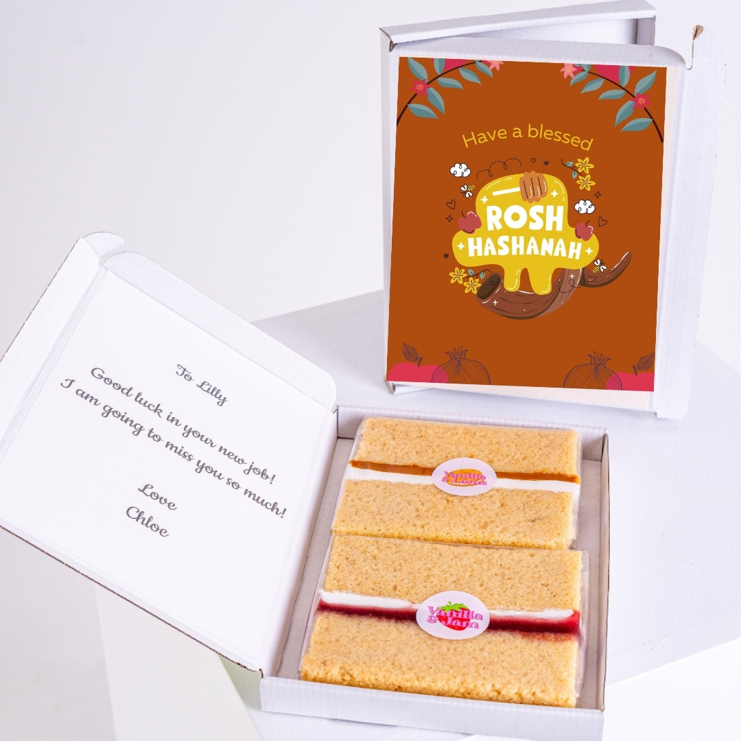 Rosh Hashanah gift box with greeting card and layered treats.